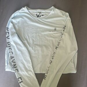 Women’s small baby blue swim shirt from Key Biscayne Ritz Carlton